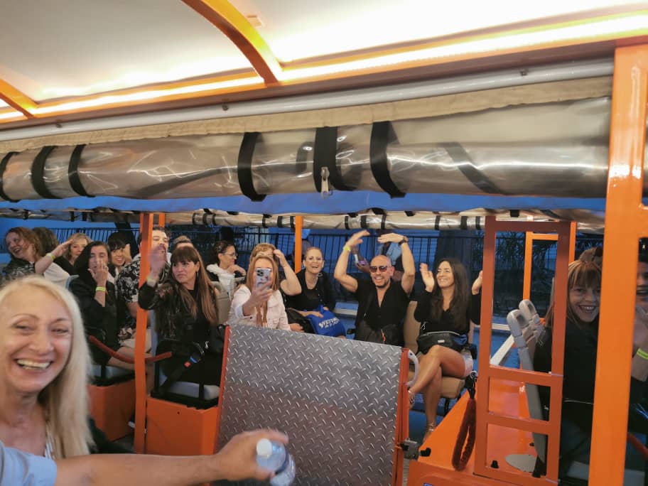 Happy group of travelers enjoying Cubatram night tour