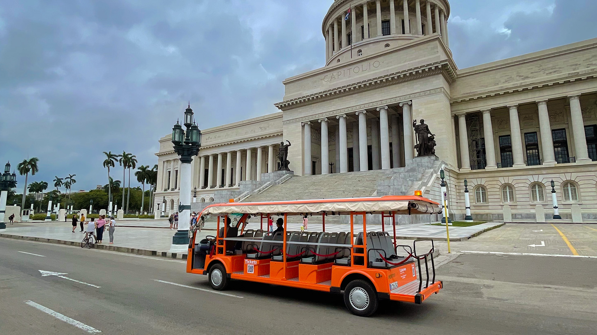 Tour guests exploring Havana with Cubatram guide